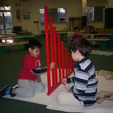 Ag Montessori School Photo #7 - Constructing with red rods.