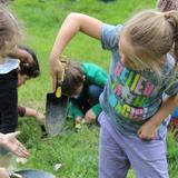 Garden Montessori School Photo #10 - Exploration in the garden and finding worms.