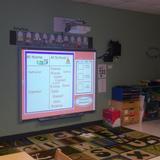 Kindercare Learning Center Photo #9 - Our interactive kindergarten program, powered by K12 Inc., is designed to encourage children to explore, communicate, and create with confidence. An interactive whiteboard engages children in collaborative learning with their peers.