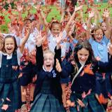 Our Lady Of Perpetual Help School Photo - Students rejoice in the autumn colors after a music class. Call us today to find out how your child can be a part of our family too!