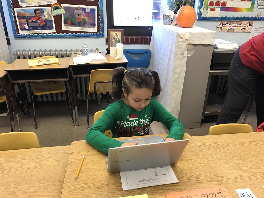 St. Elizabeth Continuation School Photo - Second grader works on Reflex Math on the Chromebook.