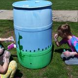 St. John The Baptist School Photo #8 - HAPPY EARTH WEEK First grade paints a rain barrel to help conserve water!