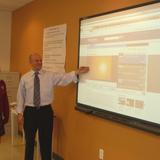 St. Rose Of Lima School Photo #3 - Mr. Boccella uses the Smart Board to reinforce his science lesson.