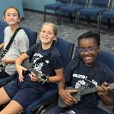 Charleston Christian School Photo #10 - Sixth graders explore their musical talents in our choir program, learning the ukulele with enthusiasm and creativity. At CCS, we nurture each child's artistic potential, fostering a love for music in a supportive and engaging environment where students can grow both academically and creatively.