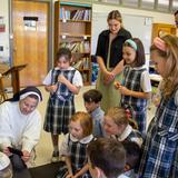 Overbrook Catholic School Photo #5 - Second graders watching chicks hatch in their classroom, an embodiment of OCS' mission of allowing each child the gift to wonder.