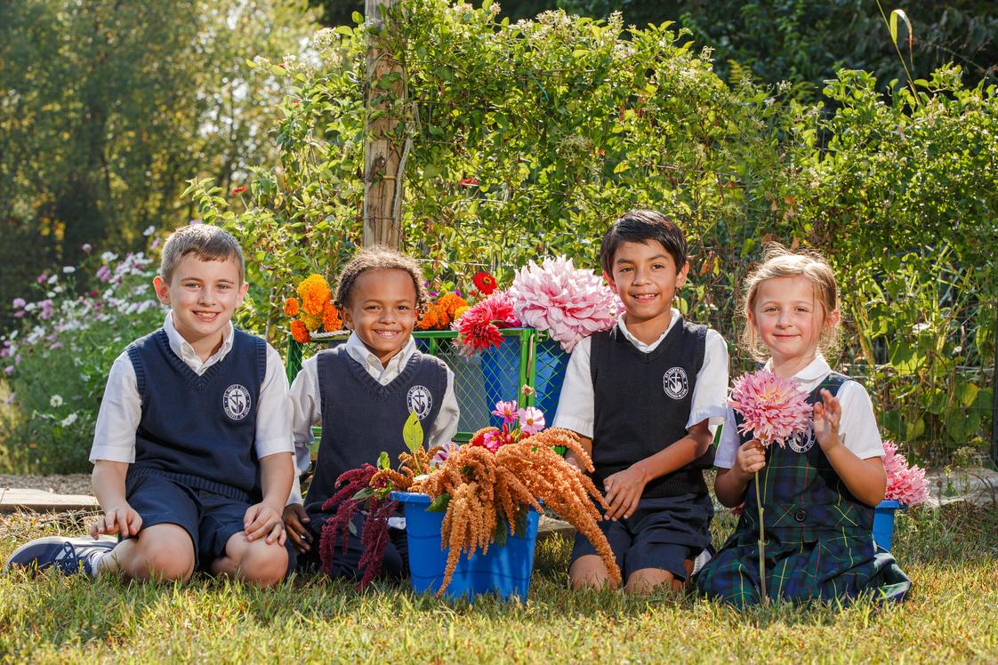 St. Mary's School Photo #1 - Our school flower garden allows us to get outside occasionally, soak in some sunshine, and get our hands dirty!