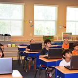 Spell Well Montessori School Photo #9 - Innovators (Third & Fourth graders) during computer class.