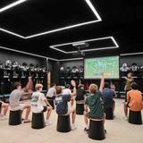 St. Andrew's Episcopal School (Southwest Parkway Campus) Photo #3 - Students utilize state-of-the-art spaces throughout Highlander Hall to sharpen their skills. Pictured here, our football players make use of one of four modern locker rooms for dedicated film study and strategy sessions.