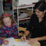 The Riverside School Photo #6 - Our 4-5th grade teacher works closely with a student on her problem solving strategies in math class.