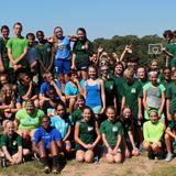 Loudoun Country Day School Photo #2 - Middle school students participate in the traditional Blue and Green Games in September after bonding in a week of activities, including using zip lines, rock climbing, and river rafting. The middle school is divided between blue and green teams throughout the year. Here they pose together after a day of outside activities.