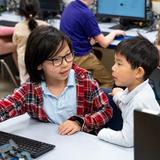 The Nysmith School Photo #5 - Inspiring the Next Generation of Innovators! A fifth grader proudly demonstrates his robot programming skills to one of our youngest students. In this activity, fifth graders introduced our Beginners to robots programmed to follow specific colors. The future of robotics starts here!