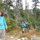 Explorations Academy Photo - Here are some of our students feeling triumphant on a multi-day backpacking trip, enjoying the beauty and bounty of our region. Explorations students develop a sense of leadership, environmental stewardship, and social responsibility both in the classroom and on the field.