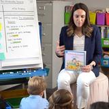 Brookfield Academy Photo #12 - Phonics, grammar, and numerical awareness are emphasized in the Primary School curriculum. Here teacher (and BA alumna) leads students in a lesson about using predictions in their reading.