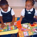 Garden Homes Lutheran School Photo #2 - K3 students enjoy picture books as a first step in their reading development.