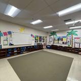 Peninsula Montessori School - Palos Verdes Campus Photo #7 - Montessori classroom with circle area and prepared learning shelves