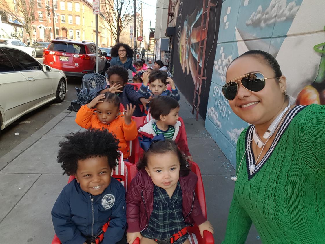 Genesis Educational Center Photo #1 - Tiny Tots going for a stroll around the neighborhood with Mrs. Kandie!
