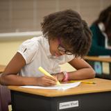 The Oaks Academy Photo #9 - A 5th grade student annotates a reading in class.