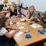 The Oaks Academy Photo #19 - Middle school students work in small groups with the teacher.