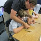 Harbour School At Baltimore Photo #8 - Hands on learning allows students to learn with all of their senses. This is a social studies class learning how tools were made in the cave man era.