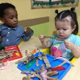 Kids Adventure Learning Center Photo #9 - Sensory fun in our Infant Classroom. We learned All About Birds and children loved exploring these "nesting" materials.