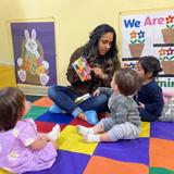 Kids Adventure Learning Center Photo #15 - Infant Room Circle time, our thematic curriculum is school wide and even our infants have daily lesson plans, goals, and activities dependent on each individual child's age and development.