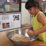 Darien KinderCare Photo #5 - Making homemade zucchini bread from our garden