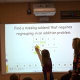Faith Lutheran Academy Photo #8 - Using the interactive board to solve our math problems.