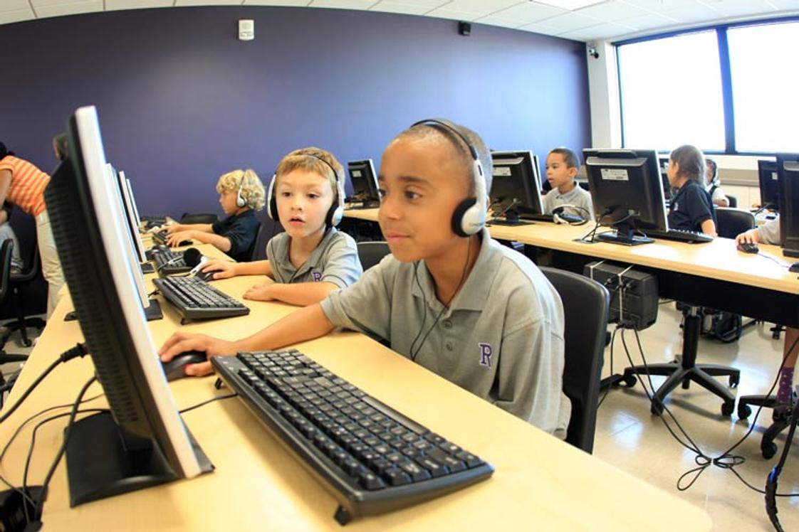 The Rock Academy Photo - Elementary students enjoy interactive learning in the state of the art computer lab.