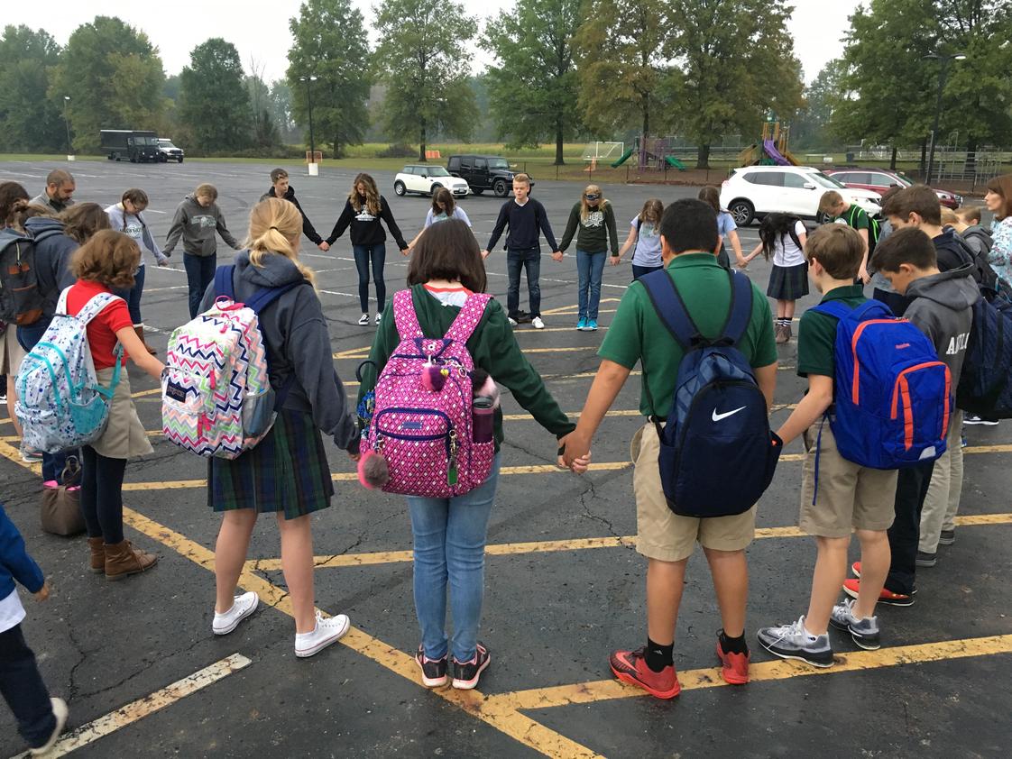 Genoa Christian Academy Photo - Students lead prayer during the annual See You at the Pole event.