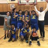 St. George Academy Photo - Boys basketball team celebrate their victory. Not shown are the girls volleyball and basketball teams.