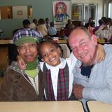 St. Francis De Sales School Photo #7 - A student with her grandparents at our Annual Grandparent Day. Grandparents come and have lunch with their grandchildren and join them at recess. This coming year will be our 7th Gandparents Day.