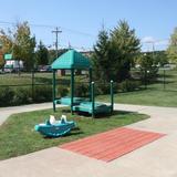 Farmington KinderCare Photo #9 - This playground is utilize by our Discovery Preschool Program. On this playground you will find ample grass space to run, tricycles with a bike path, a sandbox, sensory activities, multiple play houses and plenty of toys for the children to take out and play.