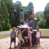 Montessori Children's House Photo - Our Elementary students on our climbing boulder.