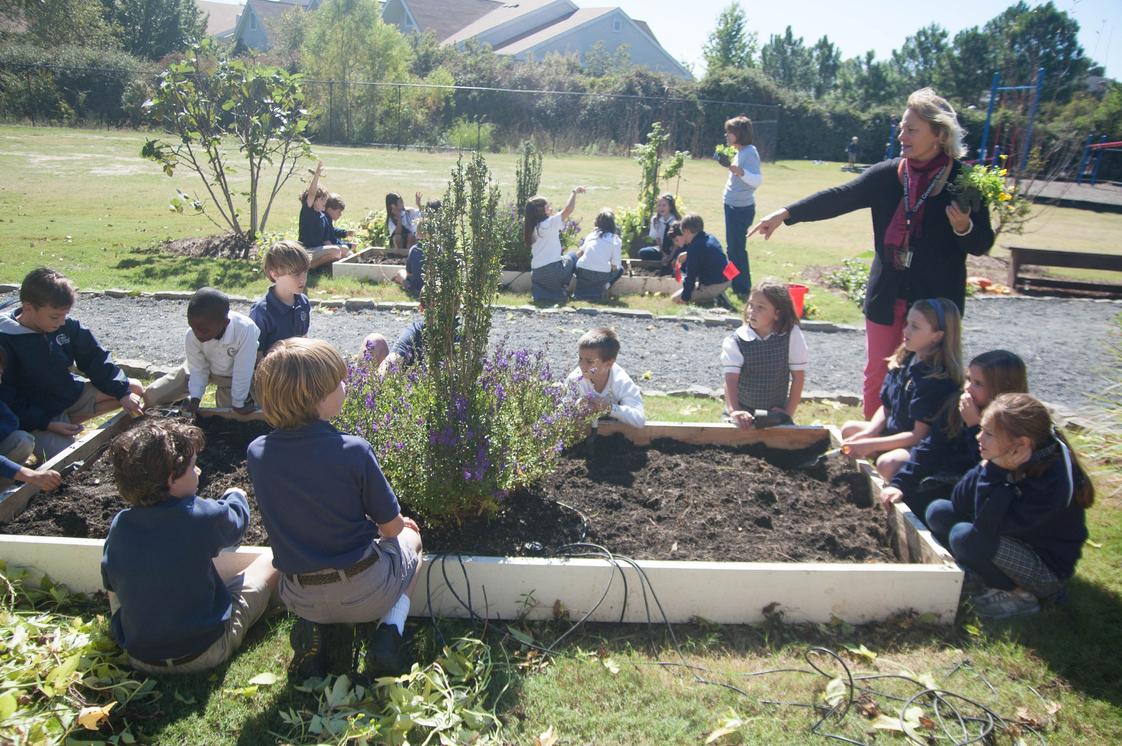 Christ Covenant School Photo - Students spend time in the school garden planting, cultivating and harvesting fruits, vegetables and flowers.