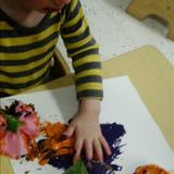 Woodridge South KinderCare Photo #5 - Devin had fun painting with flowers and of course his hands.