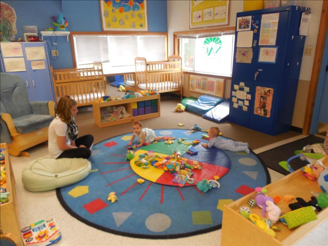 New Lenox KinderCare Photo #1 - Hanging out with Miss Sarah for Tummy Time!