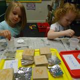 Telegraph Road KinderCare Photo #4 - Preschool curriculum activities - science experiment for absorb vs. repel.