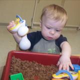 West Cedar Rapids KinderCare Photo #8 - DJ playing in the sensory table