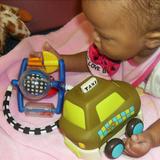 Matteson KinderCare Photo #1 - Infant Classroom exploring her fine motor skills