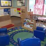Apple Valley KinderCare Photo #8 - The children love to spend time in the cozy and spacious library area. Many children will choose to relax here throughout the day. The libary is also one of our learning centers and new books are added to the library every week for the children to explore. The children also have access to our dramatic play area which is changed every two weeks into a new and exciting area that relates to the theme.
