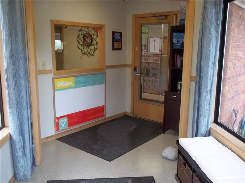 Apple Valley KinderCare Photo #2 - This is the first area that you will encounter when you visit our center. There is an area for families to sit as well as informational books. There is a window that allows the Center Director and Assistant Director the chance to see who is entering the building. The door also has a code that only current families know.