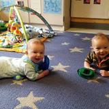 Washington Township KinderCare Photo #4 - The infants are all smiles as they have fun during tummy time.