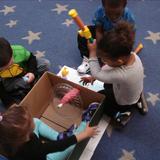 Cooley Street KinderCare Photo #6 - Children riding in the boat fishing during our water theme.