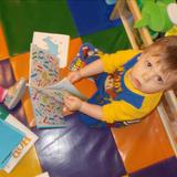 Florence KinderCare Photo #4 - Jaxson loves to read in our Infant roo!