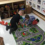 Canton KinderCare Photo #9 - Two of our preschool students having races through town.
