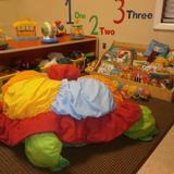 KinderCare at Hunt Club Photo #5 - A soft area that allows for safe climbing and a place to relax with many books