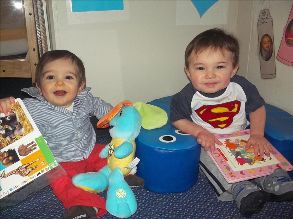 Naperville KinderCare Photo #1 - Story time is one of the many language building activites in the infant classroom.