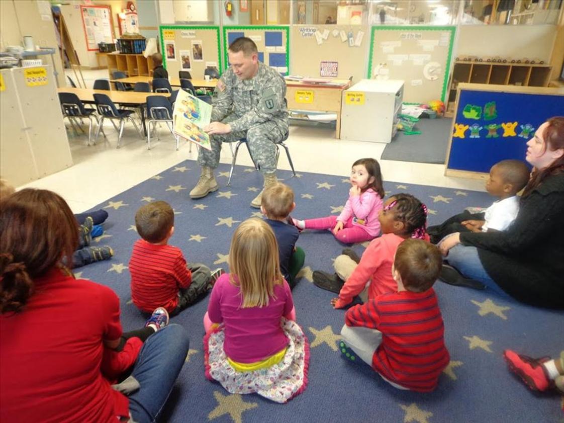 Old Sauk Road KinderCare Photo - Our guest of honor on military appreciation day reading the Preschool class a story