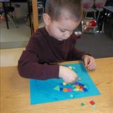 Highland KinderCare Photo #10 - Working hard to finish his work of art.