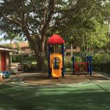 Coconut Creek KinderCare Photo #9 - Our toddler playground is perfectly sized for our younger students, and separated from the older students. This allows our younger ones to play freely under the shade of our mature trees that keep the playground cool.